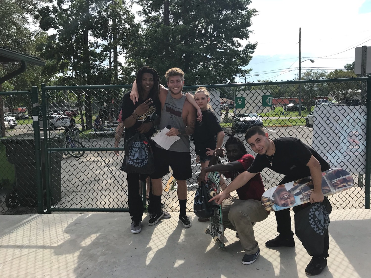Sponsored winners were, left to right, Darius Sibley, Marcus Lizzmore and Dom Borrero. With the trio is OP Skate Park announcer Anthony Caputo and prize girl Courtney Green.